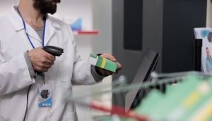 pharmacist scanning a pharmaceutical product